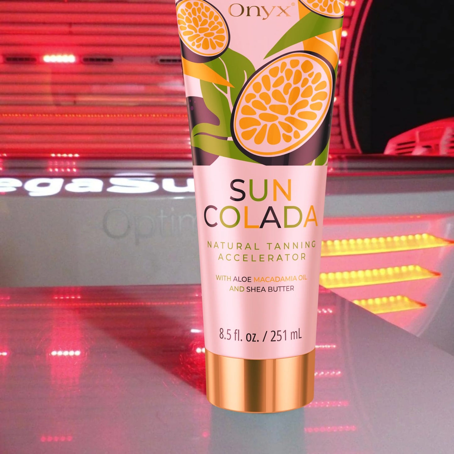 Onyx Suncolada Accelerator sunbed cream standing inside a sunbed with glowing red lights, highlighting its tropical design and natural tanning accelerator formula with aloe and shea butter.